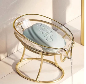 Elegante jabonera de vidrio con forma de hoja y soporte de alambre dorado con desagüe integrado. Disponible a precios de mayorista. - Product Image 1