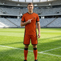 Uniforme de fútbol moderno sublimado con textura naranja y negra, conjunto de uniforme de fútbol para entrenamiento deportivo