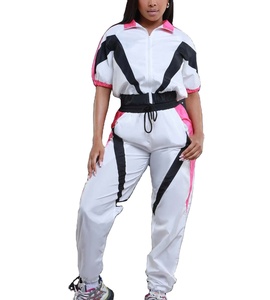 Conjunto deportivo de dos piezas al por mayor, chaqueta cortavientos larga con cremallera, estampado, logotipo bordado, ropa deportiva para mujer 2027 - Product Image 1