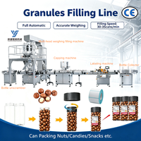 Ligne de production de remplissage automatique de granulés et de noix (pistaches, noix, amandes, arachides) en bouteilles, bocaux et boîtes en plastique avec pesage intégré
