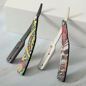 Navaja Quirúrgica Plegable Morje de Acero Inoxidable con Hoja Única y Mango de Plástico con Diseño de Calavera para Barbería - Product Image 1