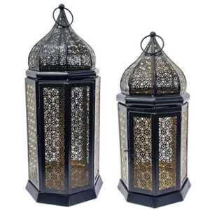 Tall cylindrical metal lantern trio ornate cutout patterns dome shaped <b>top</b> warm glowing light elegant craftsmanship indoor - Product Image 6