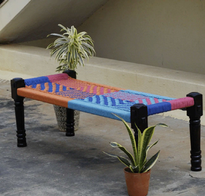 Rustic <b>wooden</b> charpai <b>bench</b> showcasing a colorful multi-stripe woven rope pattern, available at wholesale prices. - Product Image 5