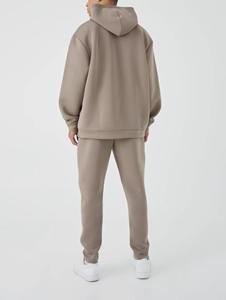 Ensemble survêtement homme coupe ample et décontractée, sweat à capuche court épais 450 g/m² 100 % coton avec logo personnalisé et pantalon de survêtement ample - Product Image 1