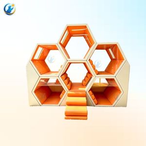 Structure de jeu intérieure moderne et épurée pour enfants avec cadre en nid d'abeille symétrique et intérieurs aux tons vibrants, incluant toboggans et escaliers - Product Image 1