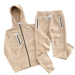 Elite men's athletic sets. Features modern color-block zip <b>jackets</b> and matching joggers in high-stretch tech fabric. - Product Image 1