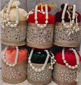 Ensemble de sacs Potli en velours luxueux et faits à la main, aux couleurs riches et aux broderies miroir complexes, conçu pour sublimer les occasions festives. - Product Image 1