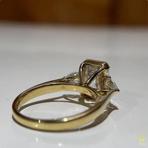 Elegant <b>Emerald</b> Cut Lab Grown Diamond Engagement <b>Ring</b> With Pear Side Stones In Yellow Gold For Women - Product Image 3