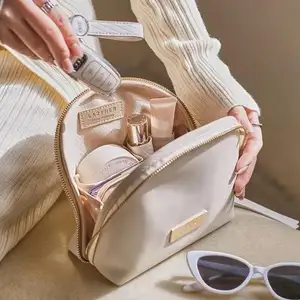 Nouvelle mode coquille forme PU sac cosmétique demi-cercle voyage dame maquillage sac de rangement