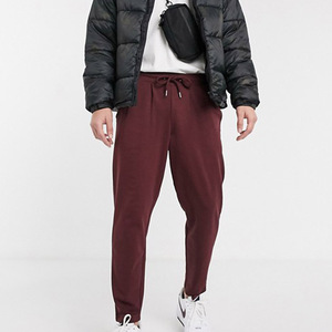Pantalon de survêtement bordeaux pour homme, taille élastique, poches latérales, décontracté, respirant, en polyester et coton tricoté, pour l'automne - Product Image 1