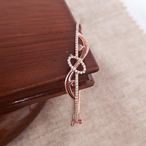 Bracelet Revalia en argent sterling 925 plaqué or rose avec breloque nœud infini et diamant, finition rhodium, élégant cadeau pour femme - Product Image 1