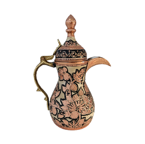 A golden embossed dallah that features camel engravings and is accented with coloured stones, available at wholesale prices. - Product Image 2