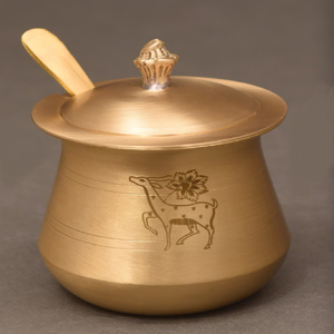 Charming antique brass ghee <b>pot</b> rests gracefully on a natural stone with a custom spoon. Available at wholesale price. - Product Image 3