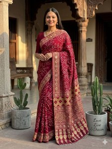 Elegant deep pink satin silk saree with unique prints rich pallu lace border and <b>designer</b> aari mirror work party wear attire - Product Image 1