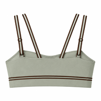 Soutien-gorge de sport personnalisé en gros, en nylon et élasthanne, couleur sauge, maintien moyen, bretelles spaghetti, rayures contrastées, pour le yoga et les activités sportives