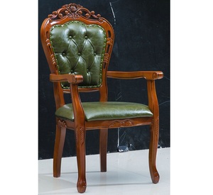Fauteuil de salle à manger de luxe en bois massif, artisanal, avec sculptures florales ornées et assise capitonnée en cuir vert - Product Image 1
