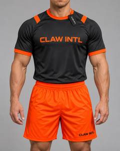 Maillot de football CLAW INTL pour homme, noir et orange, imprimé par sublimation, col rond, manches courtes, évacuation de l'humidité, polyester, coupe athlétique - Product Image 1