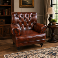 Fauteuil classique en cuir véritable à dossier haut avec design capitonné et pieds en bois massif, chaise élégante pour salon et chambre à coucher