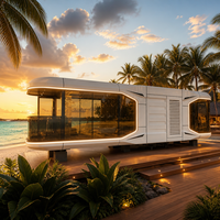 Maison capsule spatiale préfabriquée de luxe, villa mobile futuriste avec verrière panoramique pour complexe balnéaire et glamping