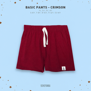 Pantalon basique rouge pour enfants, en tissu de coton doux, offrant une grande liberté de mouvement pour rester confortables lors des activités quotidiennes intenses. - Product Image 1