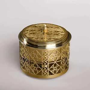 Golden Cylindrical <b>Storage</b> Container with Lid Intricate Geometric Cut Out Pattern Polished Metal Finish Ornamental Design - Product Image 1