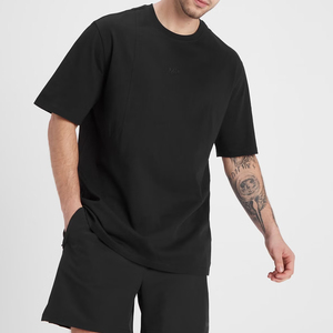 T-shirt en coton noir pour homme, col rond, manches courtes, décontracté, couleur unie, coupe ajustée, longueur standard, style tricoté uni - Product Image 1