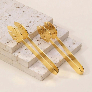 Pince à salade en forme de feuille de Monstera dorée, ensemble d'ustensiles en métal poli miroir pour la table de fête - Product Image 1