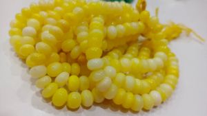 ลูกปัดโอปอลสีเหลืองทรงรอนเดลล์ เรียบเนียน ขนาด 7 ถึง 10 มม. ขายเป็นเส้น ยาว 8 นิ้ว ยี่ห้อ EMINENT JEWEL N ARTS ผลิตจากรัฐราชสถาน - Product Image 2