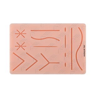 Tapis d'entraînement à la suture avec plaies pré-découpées, kit de sutures, instruments médicaux, formation pour étudiants en médecine et en médecine vétérinaire, durable - Product Image 1