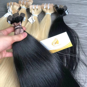 Precio al por mayor Extensiones de cabello Remy 100% con cinta adhesiva, cabello humano vietnamita de color claro, material virgen con cutícula pre-organizada, 8-32 pulgadas - Product Image 1