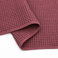 Serviette de bain jetable Donky Premium en coton 100% écologique, tissage gaufré, douce et à séchage rapide