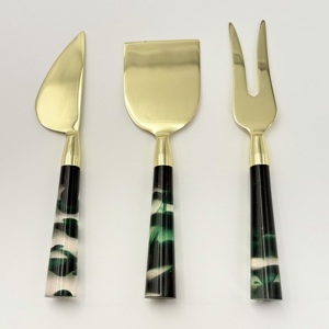 ชุดชีสโลหะสีทองสุดฮิต พร้อมด้ามจับเรซิ่นสีดำ บรรจุในกล่อง สำหรับโต๊ะอาหารเช้า ชุดอุปกรณ์ทาเนยและชีส - Product Image 1