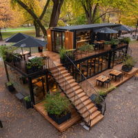 Restaurant en conteneur noir à deux étages EC-20TP avec terrasse en bois pour projets commerciaux