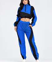 Ensemble veste coupe-vent courte à demi-zip et pantalon de jogging style streetwear colorblock bleu et noir pour femme