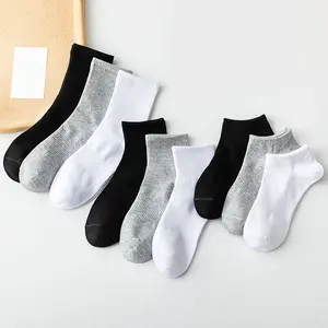 Chaussettes de sport en coton pour hommes, couleur unie, noir et blanc, vente en gros, printemps