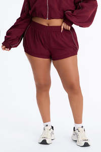 Wholesale Women’s Burgundy Two Piece Windbreaker Set with Full <b>Zip</b> Athletic Jacket and Matching High Waist <b>Shorts</b> Reflective Set - Product Image 4