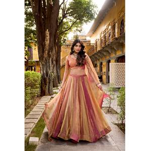 La silueta fluida y delicada del lehenga choli con bordados y la dupatta etérea se combinan para crear un look que se siente natural. - Product Image 1
