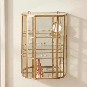 Estante de exhibición geométrico de latón y vidrio de diseño artesanal con diseño vertical para decoración de sala de estar, acabado en latón. - Product Image 1