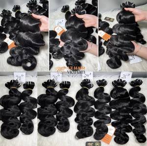 Venta al por mayor de pelo humano ondulado del cuerpo trama de color natural pelo virgen vietnamita cutícula alineada de calidad superior - Product Image 3