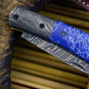 Navaja de bolsillo de acero de Damasco con hoja de punta caída, mango azul y apertura con perilla, para uso en exteriores y camping. - Product Image 4