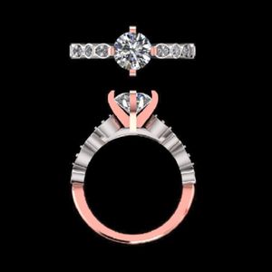 elegant round brilliant cut diamond engagement <b>ring</b> in 18kt 14k two tone rose and white <b>gold</b> with marquise shape pave <b>set</b> shank - Product Image 1