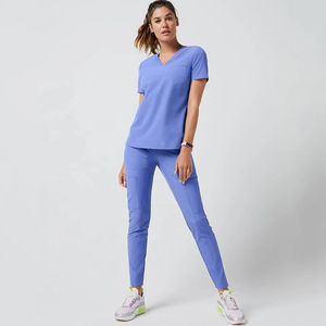 Traje de enfermera para mujer de ajuste cómodo, confeccionado con tela elástica transpirable que proporciona fácil movimiento, tacto suave y durabilidad confiable. - Product Image 4
