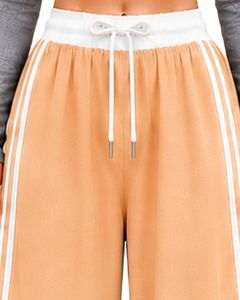 Pantalon cargo ample pour femme, couleur beige pêche, avec bandes latérales blanches, taille haute, coupe décontractée, style streetwear, personnalisable par le fabricant - Product Image 5