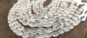 Cristales de roca natural facetados ovalados de 10 a 12 mm, forma Mani, se venden por hebra de 13 pulgadas de largo. - Product Image 3