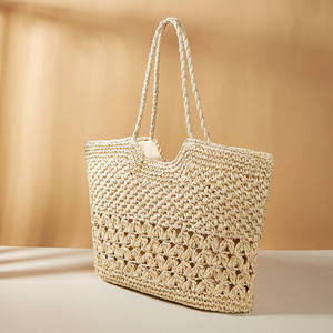 Experience effortless elegance with this stunning Natural yarn bag featuring a carved <b>top</b> line and a patterned bottom accent - Product Image 2