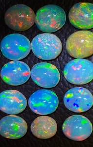 Piedra preciosa de ópalo etíope natural de 8x6 mm - Gemas de ópalo cabujón sueltas de forma ovalada - Piedras lisas con juego de color al por mayor - Product Image 3