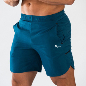 Pantalones Cortos Deportivos de Secado Rápido para Hombre Ishaq, Color Sólido, Cintura Elástica, Largo Medio, con Bolsillos, Tejido de Poliéster - Product Image 1