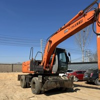 Garantie de satisfaction - Excavatrice sur pneus d'occasion HITACHI ZX130W avec une grosse réduction à vendre