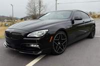 BMW Alpina B6 Gran Coupé 2017 d'occasion, 600 ch, V8 biturbo, transmission intégrale, pack Executive, noir rubis métallisé