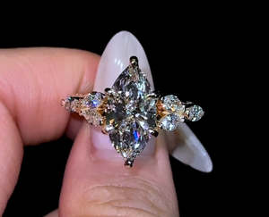 Bague de fiançailles en moissanite de forme marquise avec accents floraux latéraux en or jaune 14 carats, design de joaillerie fine pour cadeau d'anniversaire - Product Image 1